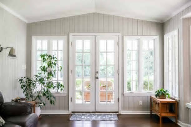 A spacious living room filled with sunlight and fresh air